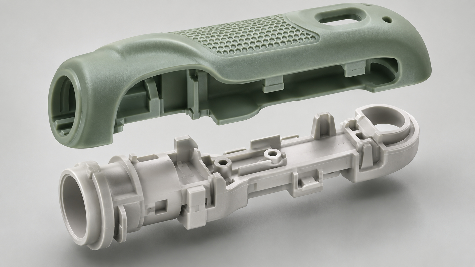 Overmolded samples and a peel-test fixture on a supplier verification bench