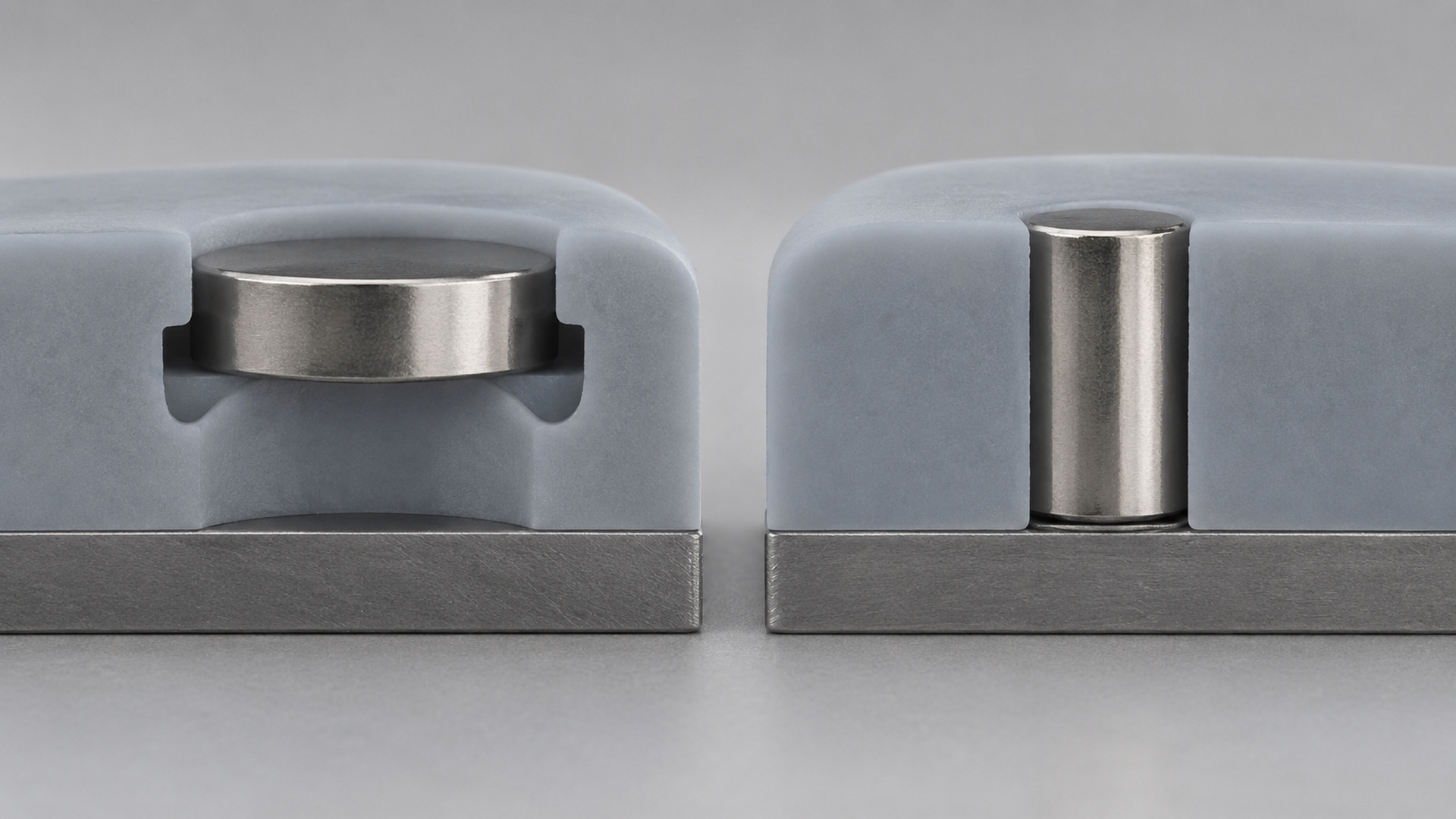 Silicone part with encapsulated magnet mounted in a vertical pull-out test fixture.