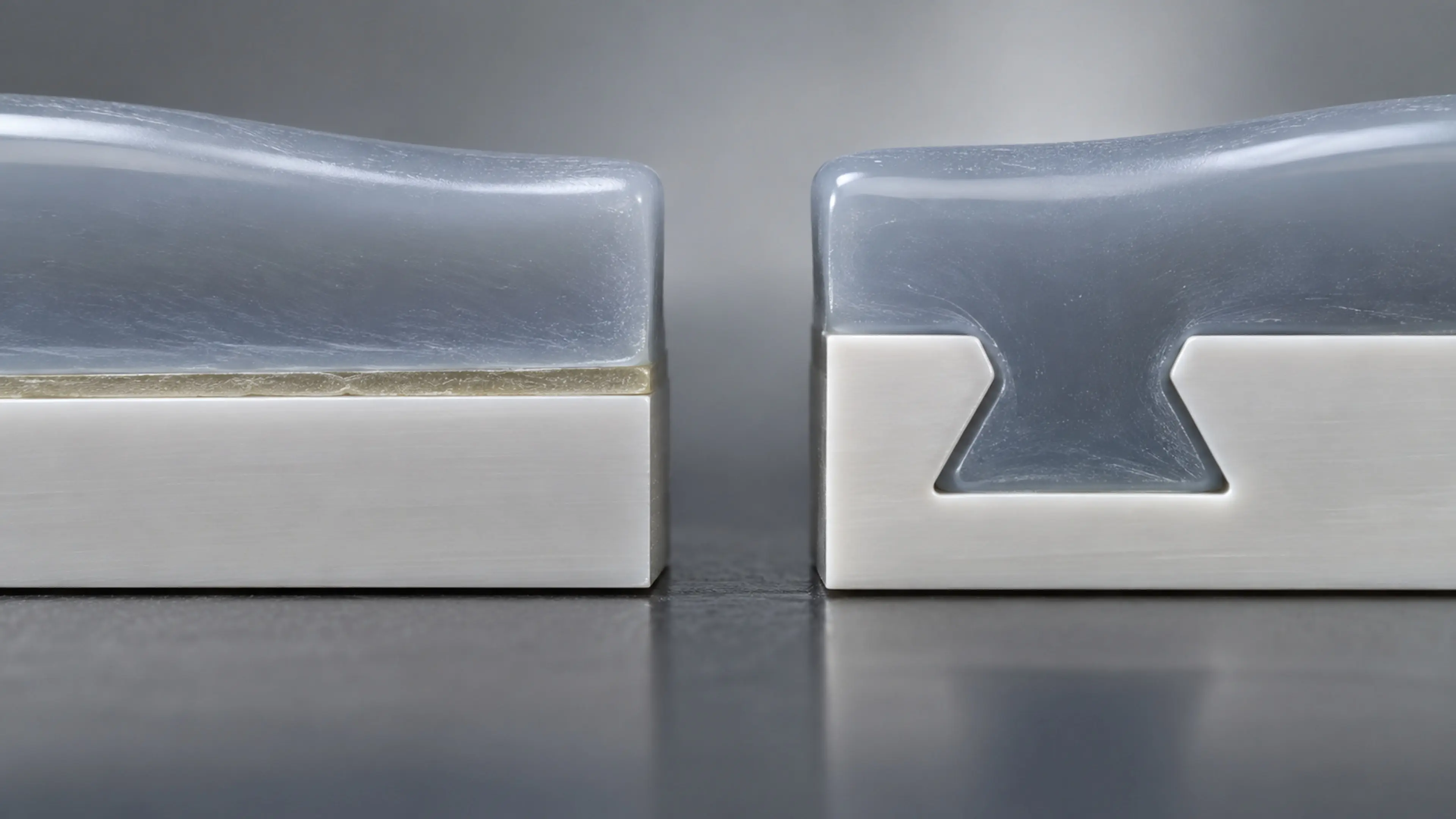 Peel test of an overmolded silicone tab from a plastic substrate, showing cohesive failure in the silicone.